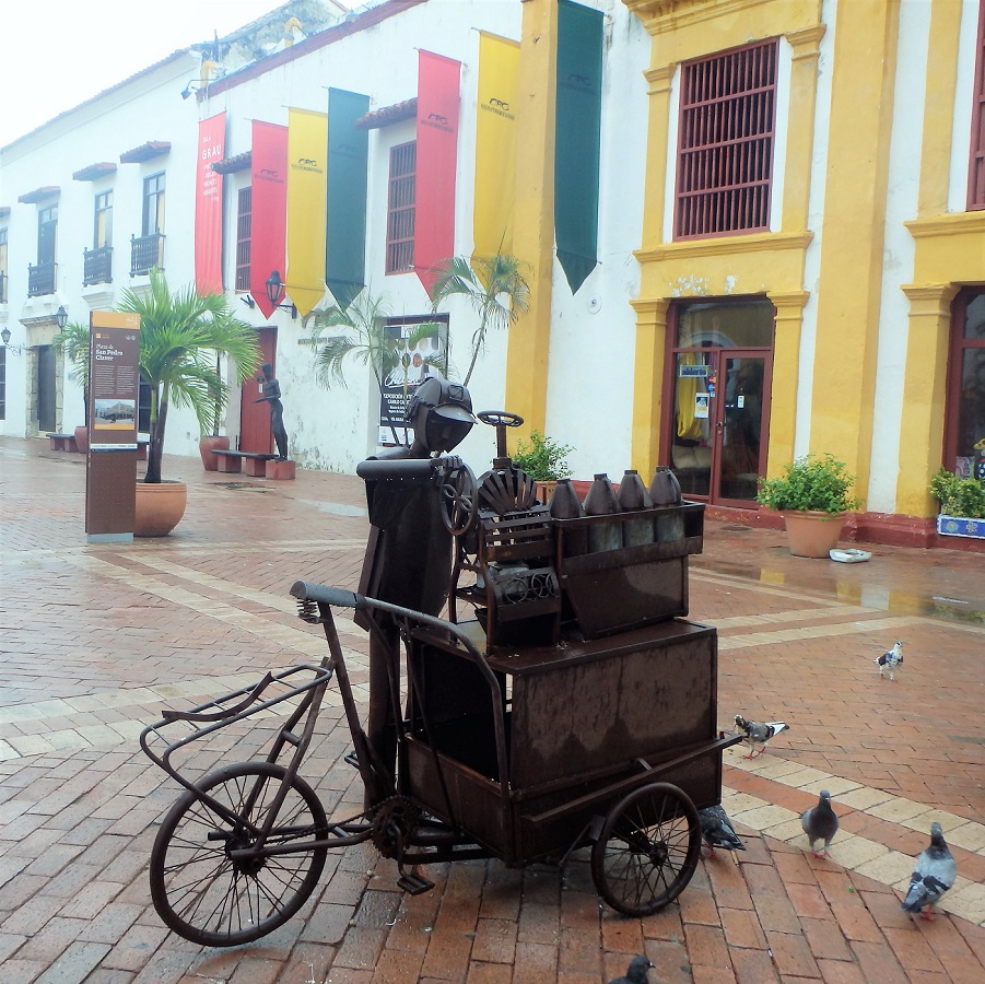 Sculptures at Plaza de San Pedro Claver illustrate the 'daily life' of working Colombians