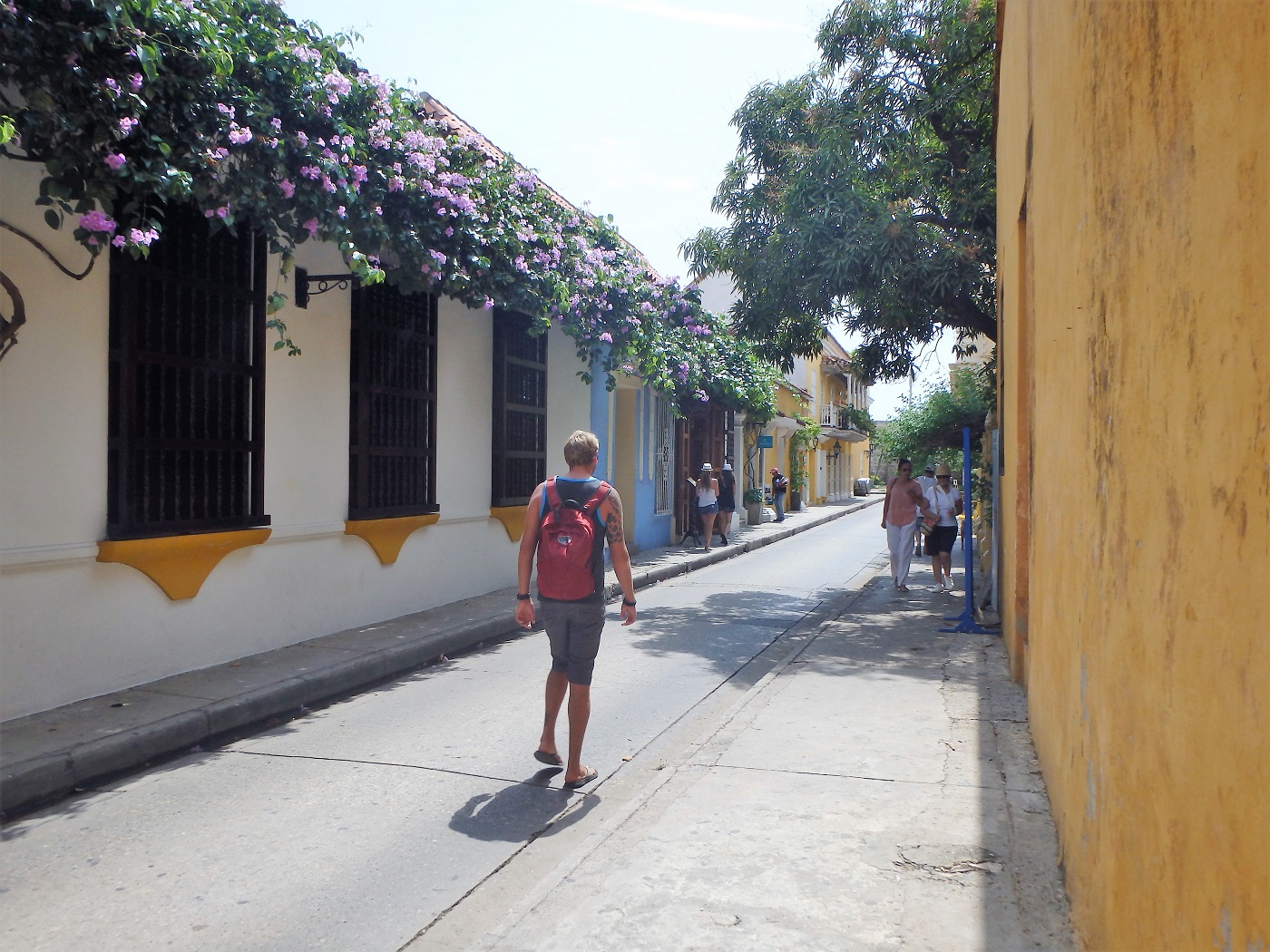 Rhys walking down a picturesque street within the old walled town