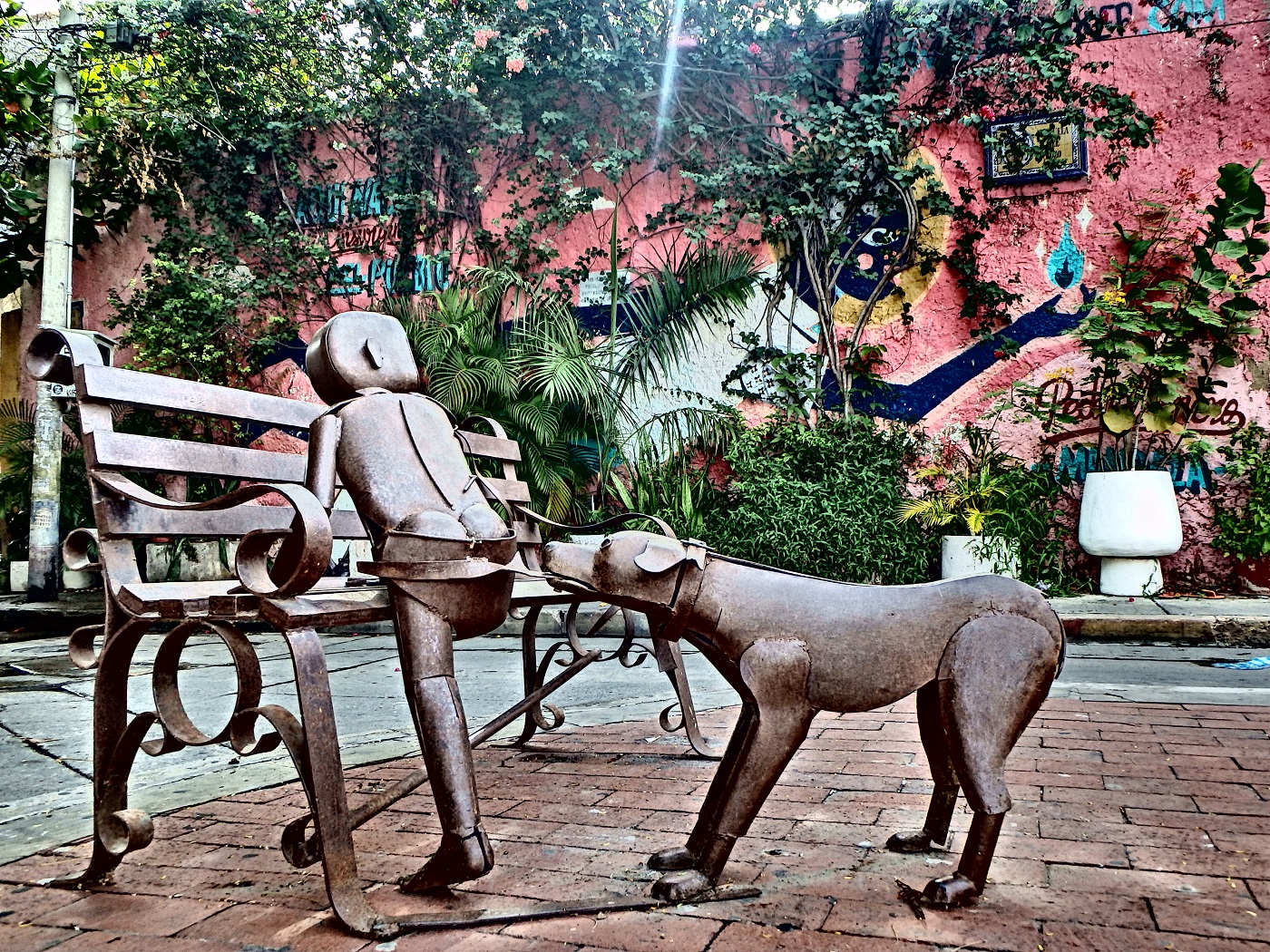 A bronze scilpture of a boy and a dog in Getsami