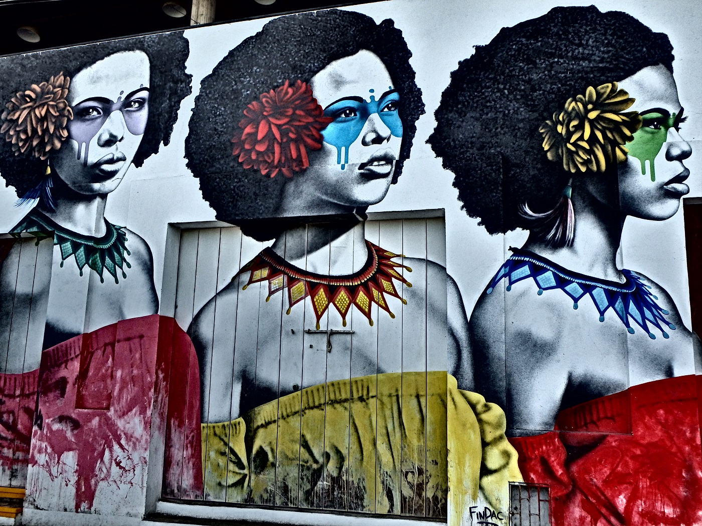 Striking street art of three women along the streets of Getsami