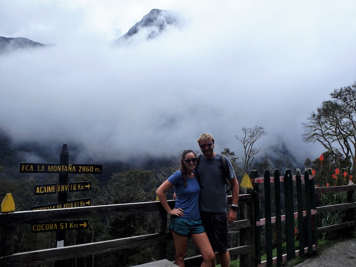 Rhys and I at the top of the trail with the fog-laden mountains behind