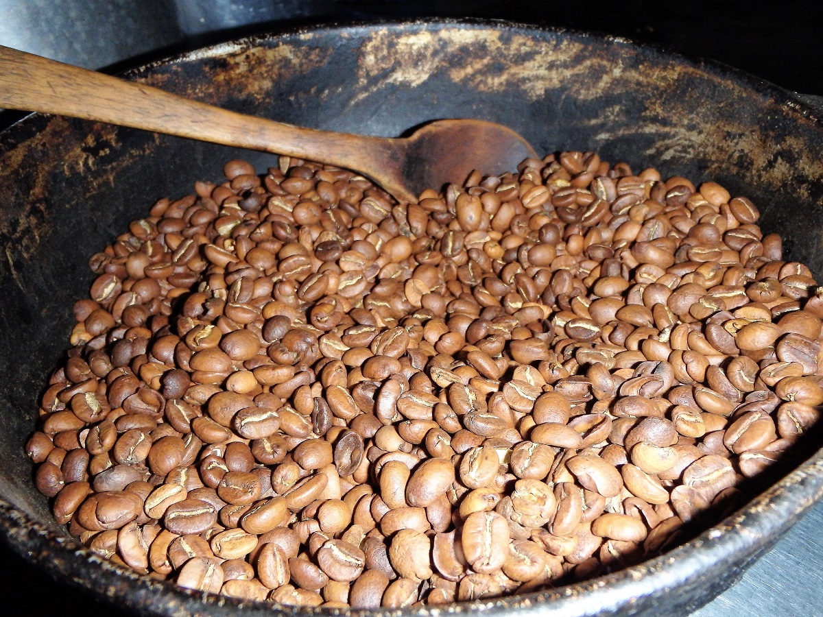 A large pot of roasted coffee beans