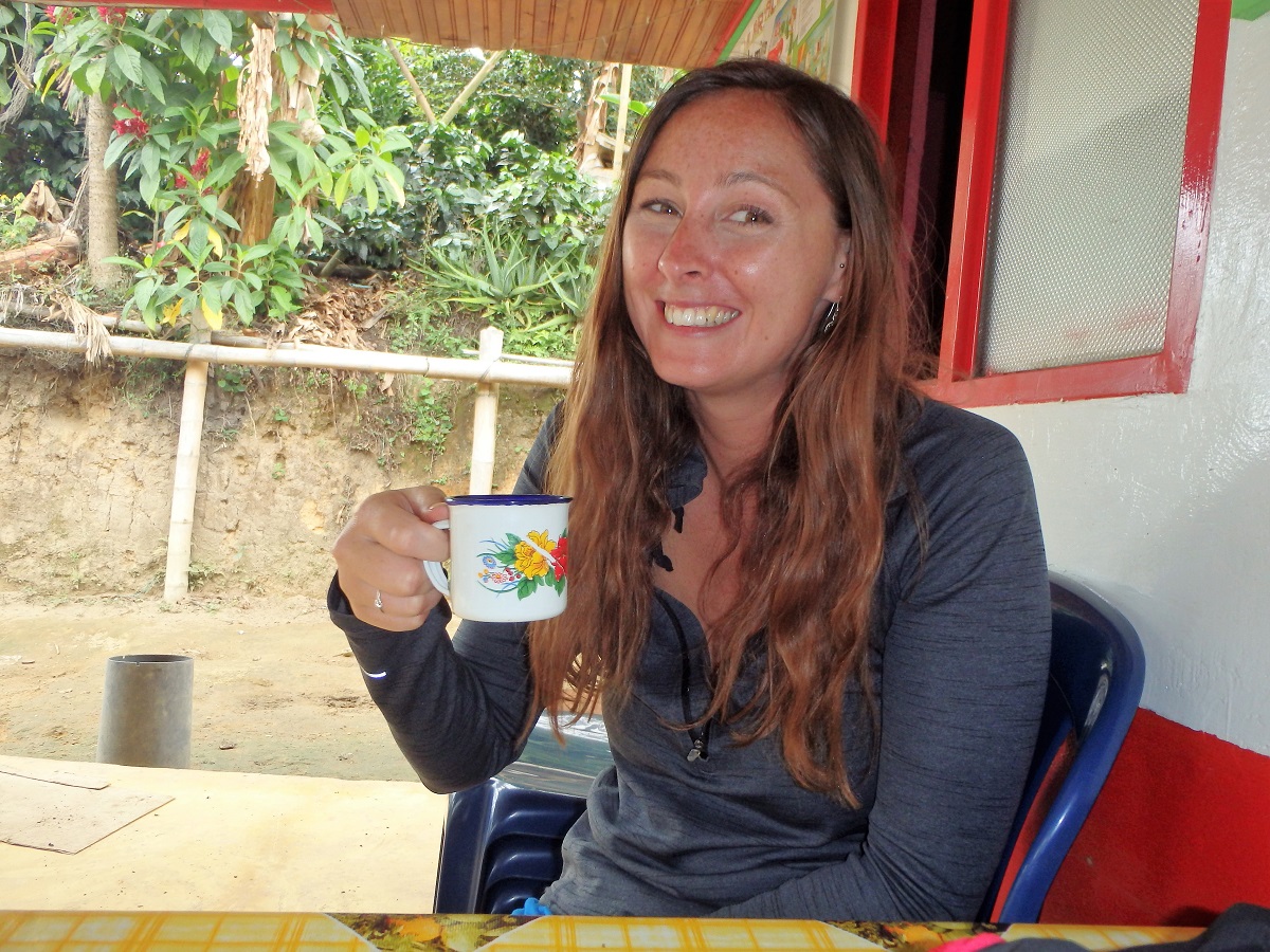 Me looking very pleased with my cup of locally grown coffee