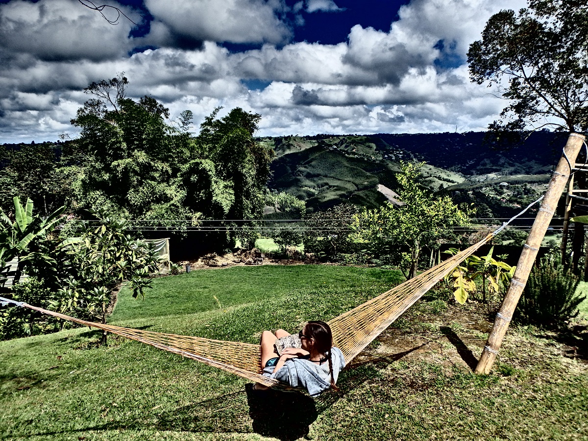 Me relaxing in a hammock in the serene landscape