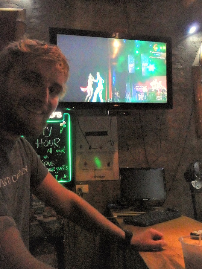 Rhys at the bar watching the salsa competition on TV