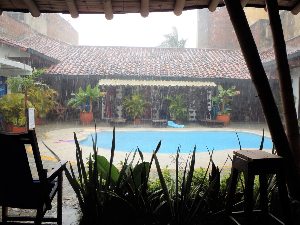 Sheltering from the rain beside the pool at our hostel