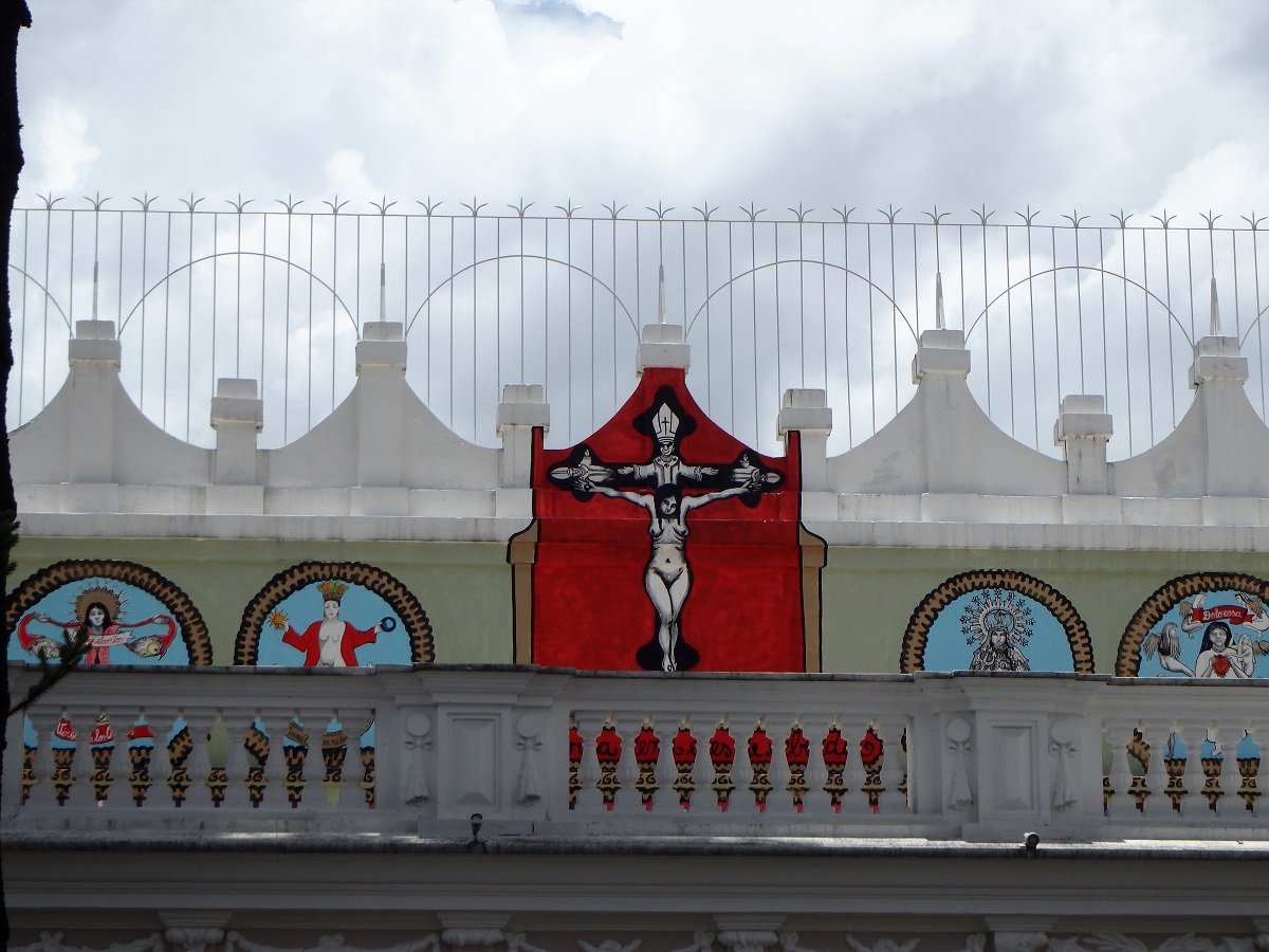 A view of an upper balcony where just the top portion of the art display can be seen