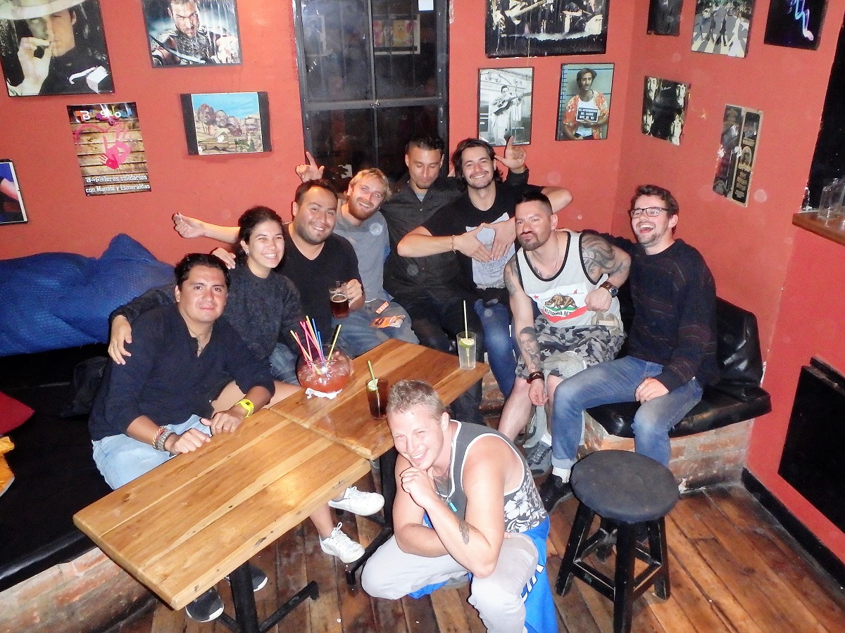 A group of us from our hostel on a night out sharing a fishbowl cocktail