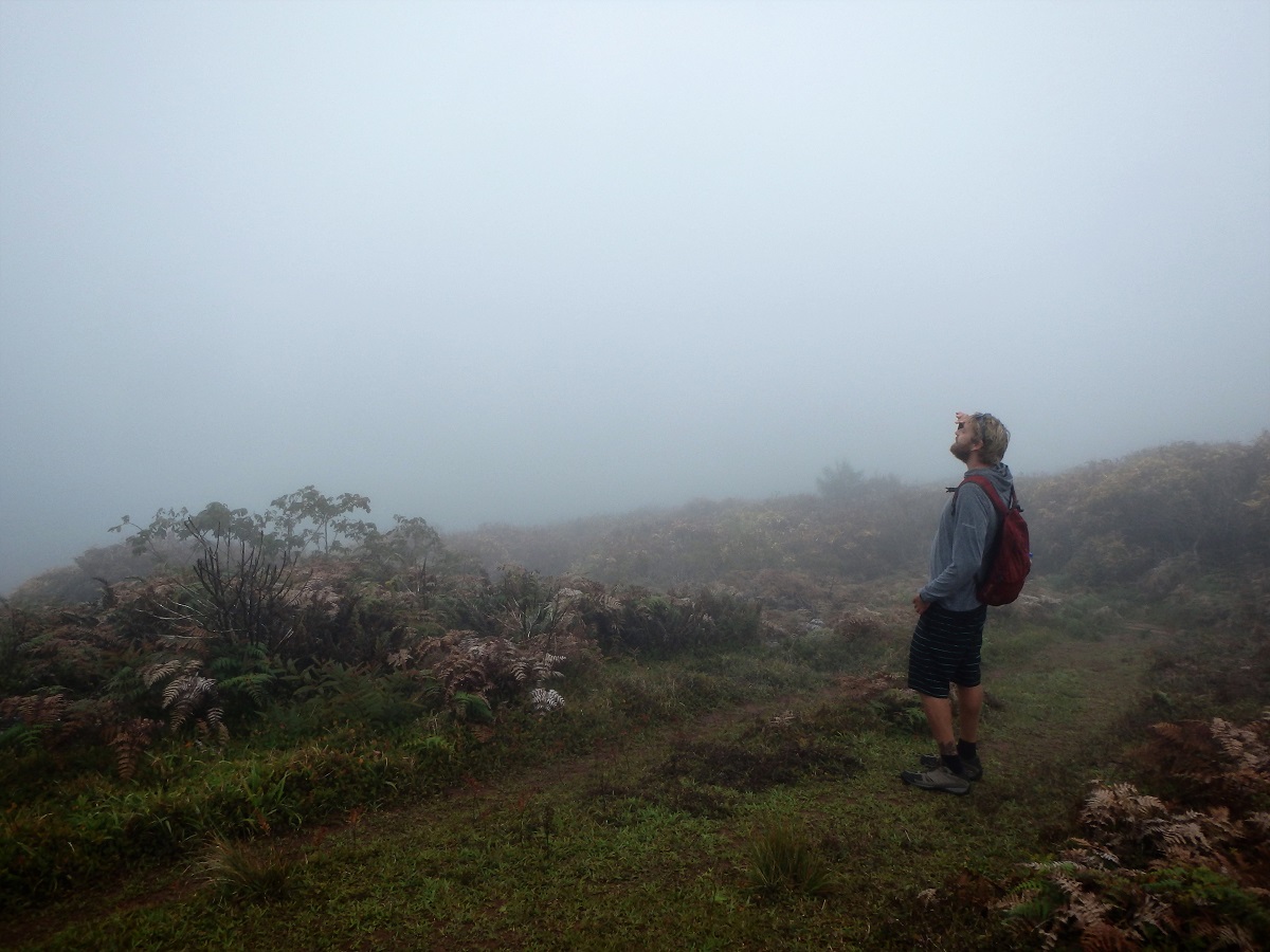 Rhys surrounded by thick fog while trying to get a glimpse of the lake