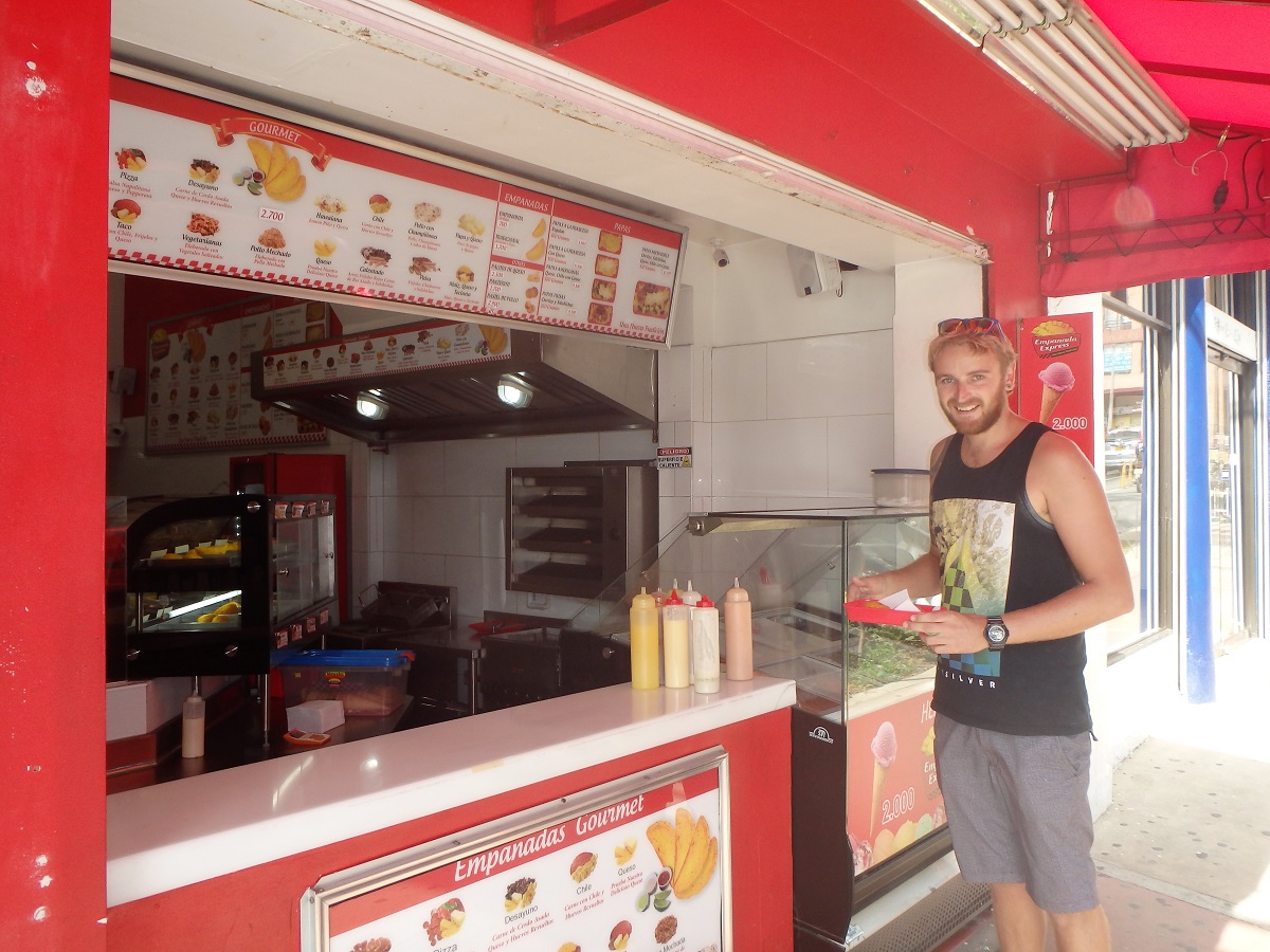 Rhys ordering empanadas in Poblado, Medellin