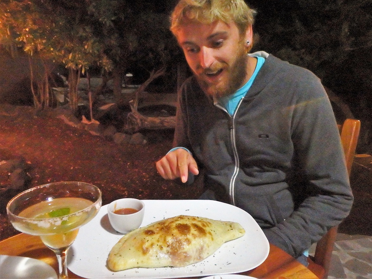 Rhys with a margarita and calzone during happy hour