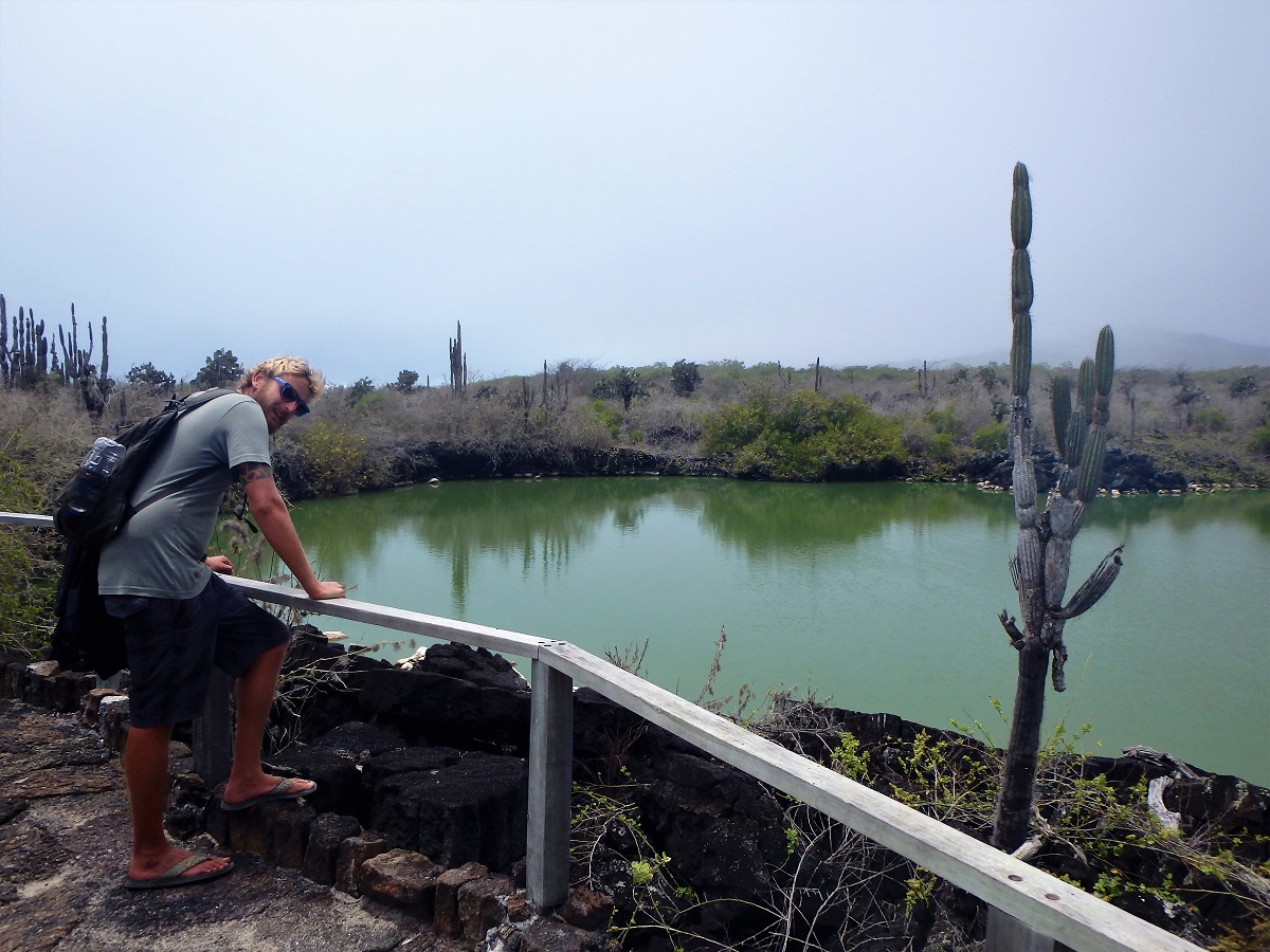 Rhys looking out at a bright green lagoon