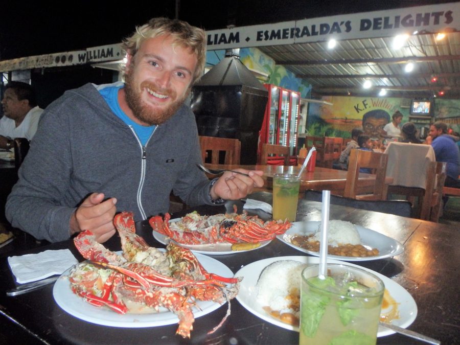 A photo of Rhys with our lobster, sides and mojitos