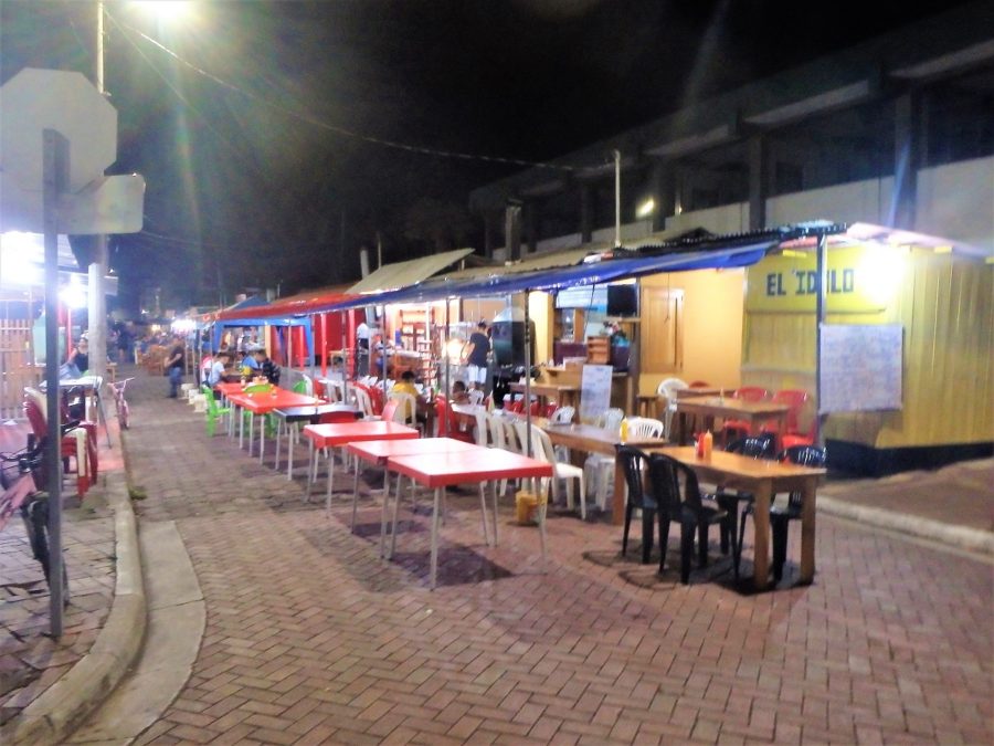 Late evening down Los Kioskos reveals tables all down the street