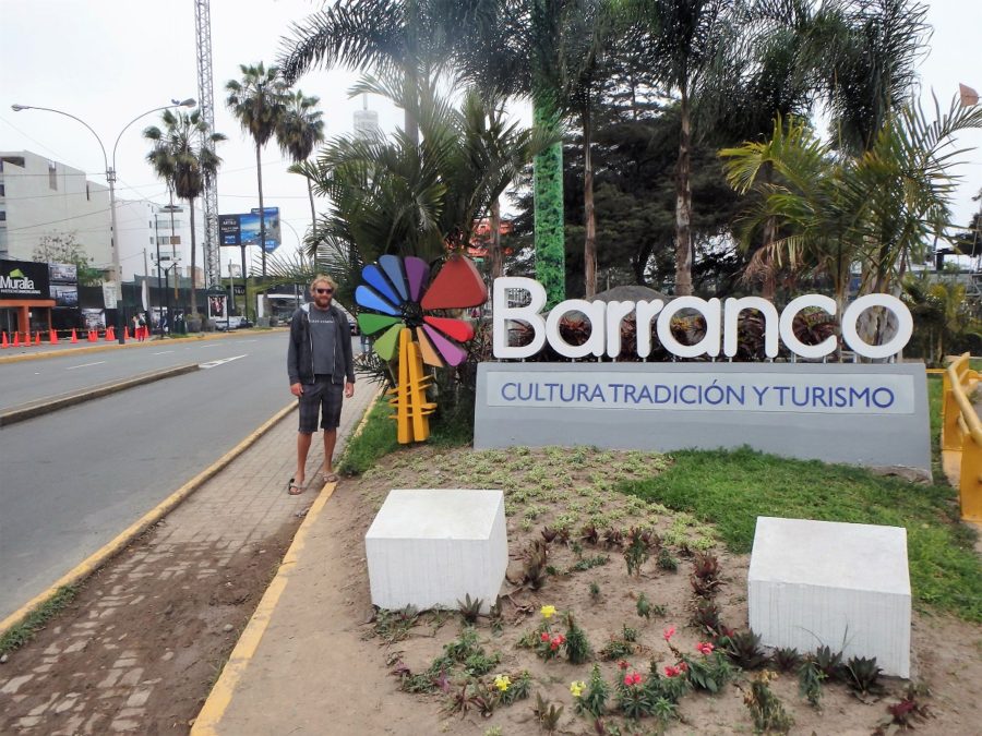 Rhys posing in front of the Barannco sign