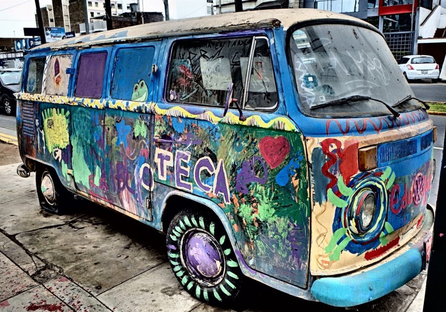 An abandoned Volkswagen van is now very colourful