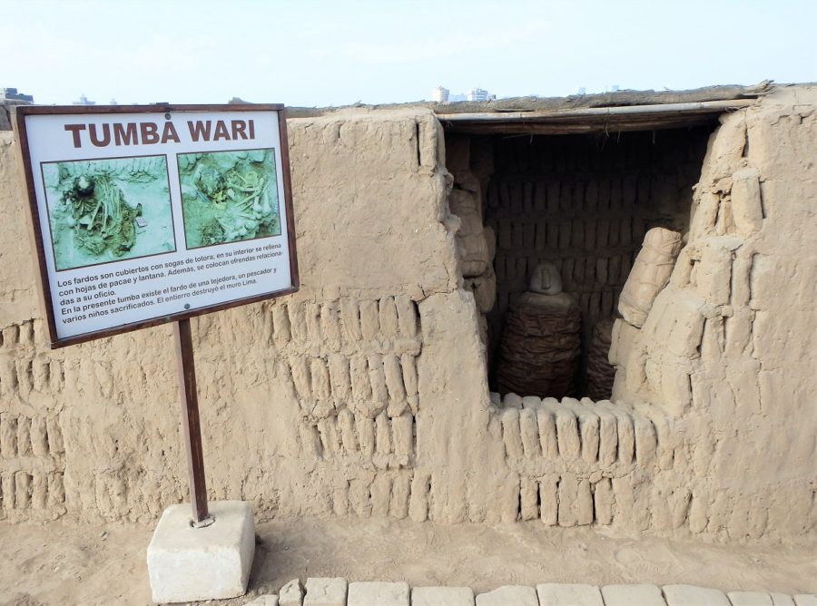 From the outside looking in with a sign marking the tomb