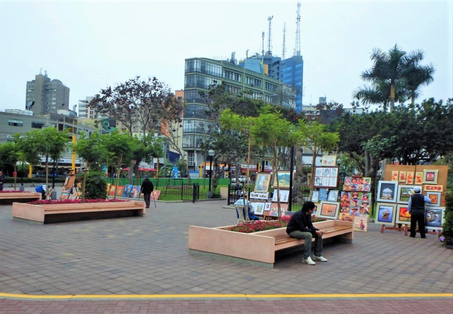 A small courtyard within the park with art on display