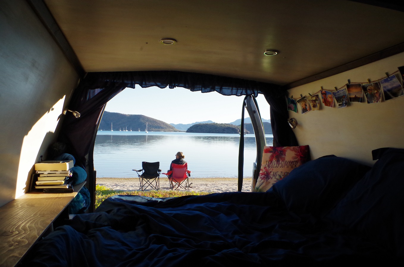 A view of the finished interior of our van, complete with photos on the walls