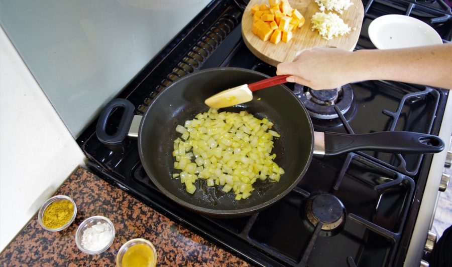 Frying onions for the curry with other ingredients ready to go.