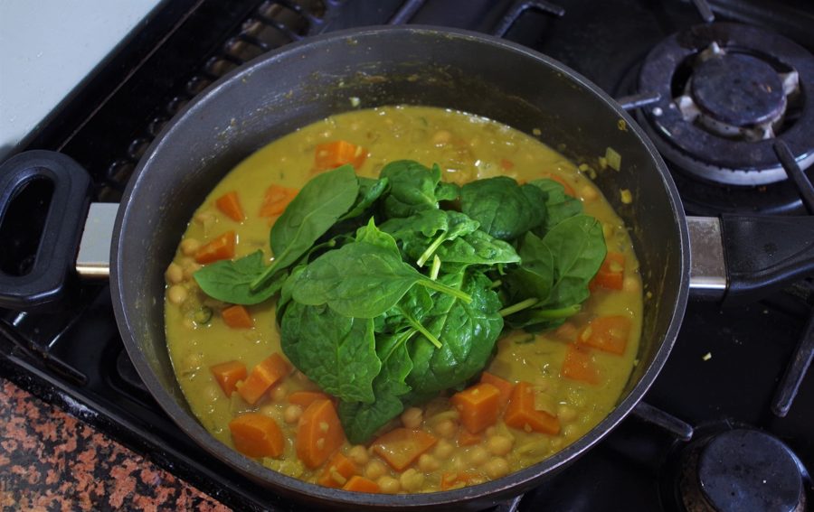 Adding spinach to the curry