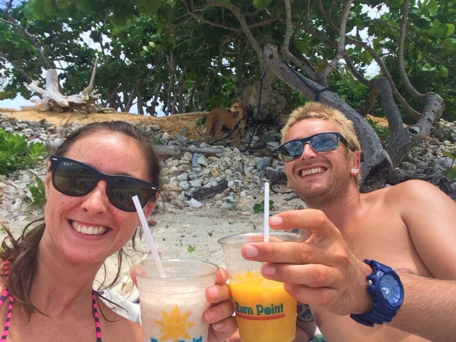 Rhys and I enjoying cocktails from Rum Point on the beach