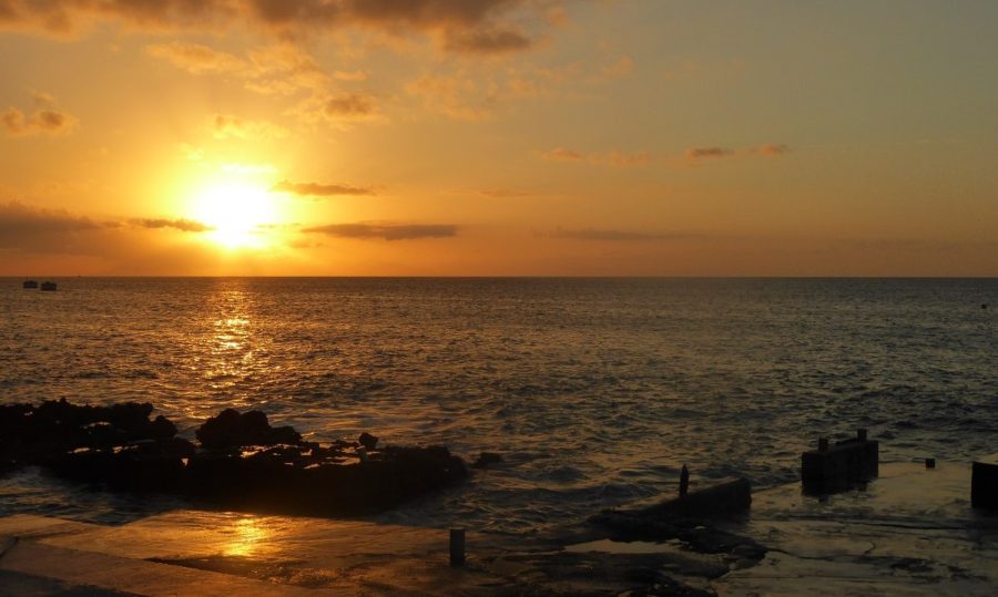 Our vacation guide to Grand Cayman includes watching a sunset