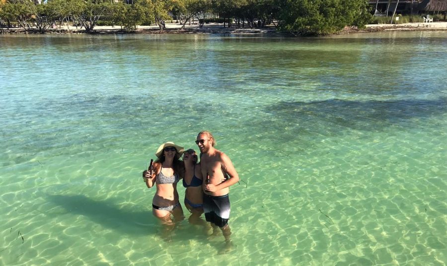 Enjoying a beer in the shallows from the boat